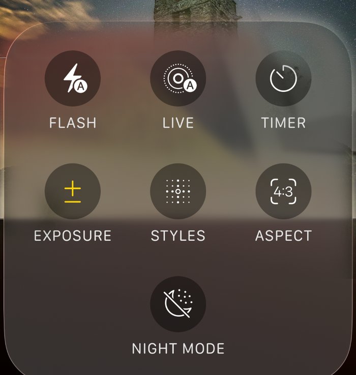 The iPhone Camera controls panel showing Flash, Live, Timer, Exposure, Styles, Aspect and, at the bottom, a Night Mode moon with a line through it because it is switched off.
