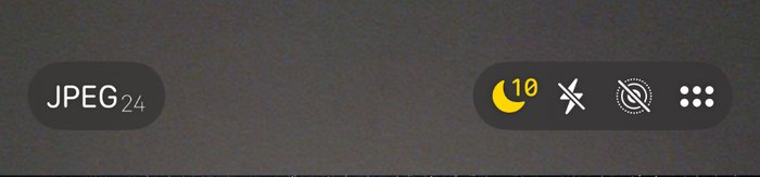 The top of the iPhone Camera screen, with a yellow Night Mode moon marked ten next to the flash and Live Photo controls.