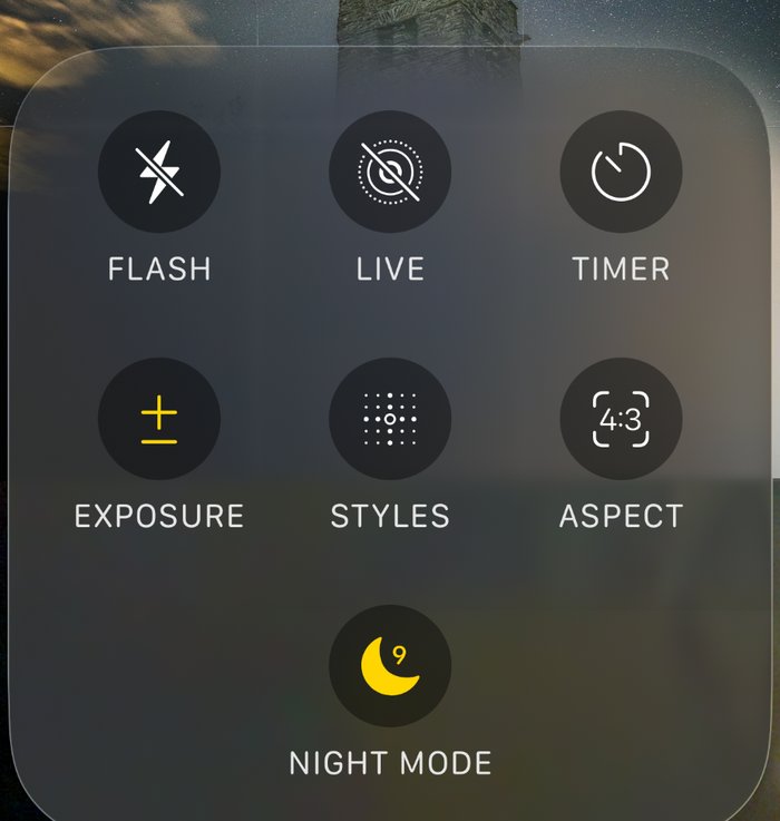The same iPhone Camera controls panel, with the Night Mode moon now solid yellow and showing the number nine, meaning it is switched on for a nine second exposure.